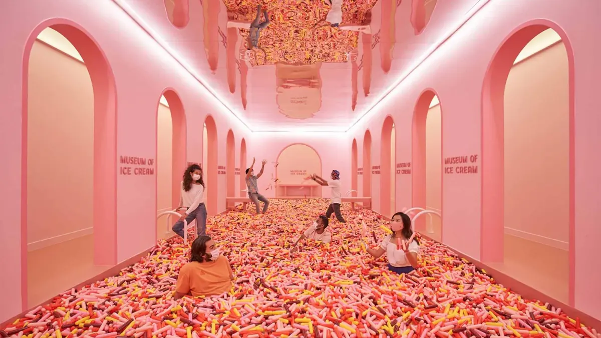 Museum of Ice Cream Singapore — A visitor diving into the giant sprinkle pool at the Museum of Ice Cream Singapore