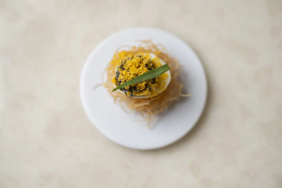 A crispy vermicelli nest with cured egg yolk at Lerouy, Singapore